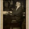 [Photography 1920] Portrait photo of dr. C.P. Burger, seated at a desk. 12x10 cm, ca. 1920.